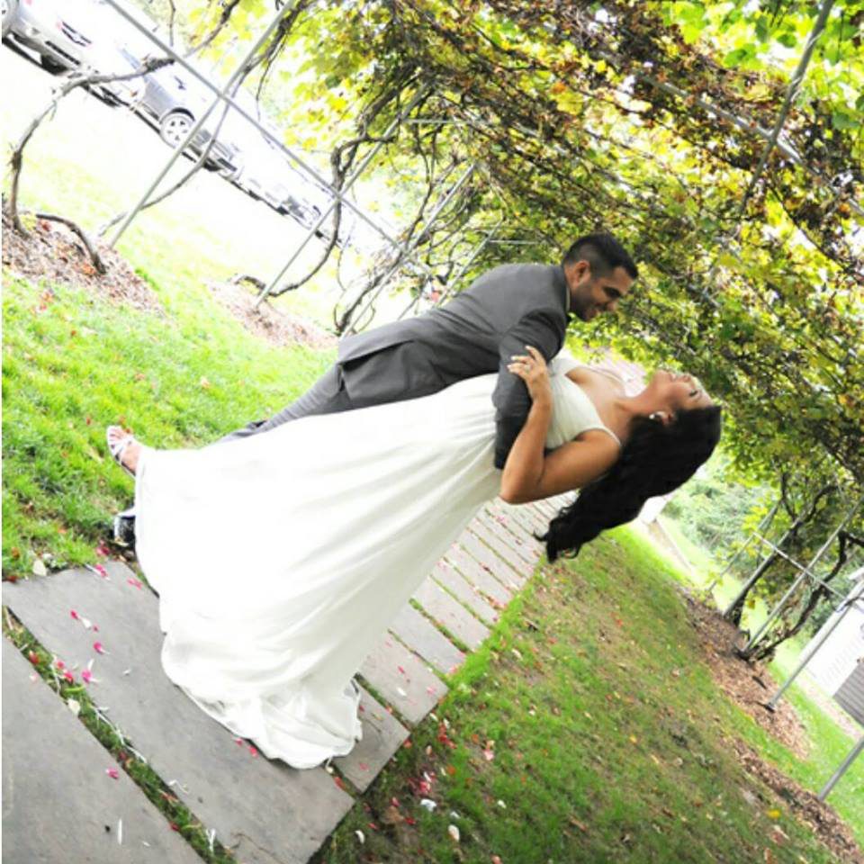 lucas dipping belinda for a kiss under the grape arbor