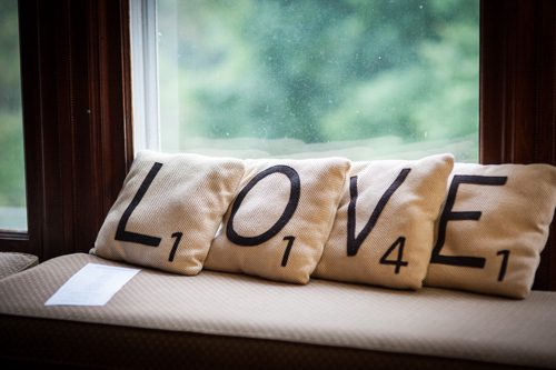 high-school-sweethearts-wed-love-pillows-as-decorations