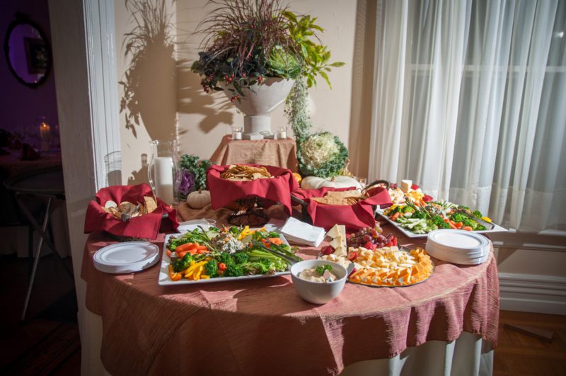 table set with cheese, crackers, vegitables