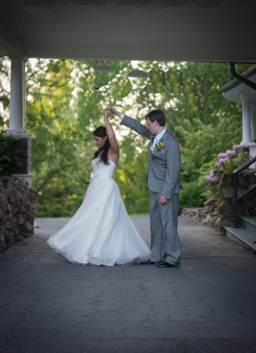 bride being twirled by groom