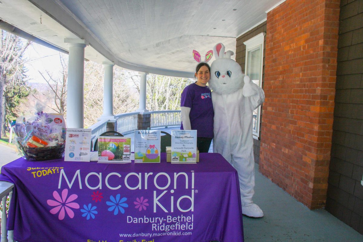 meghan frieland and the Easter bunny post for a photo on the veranda