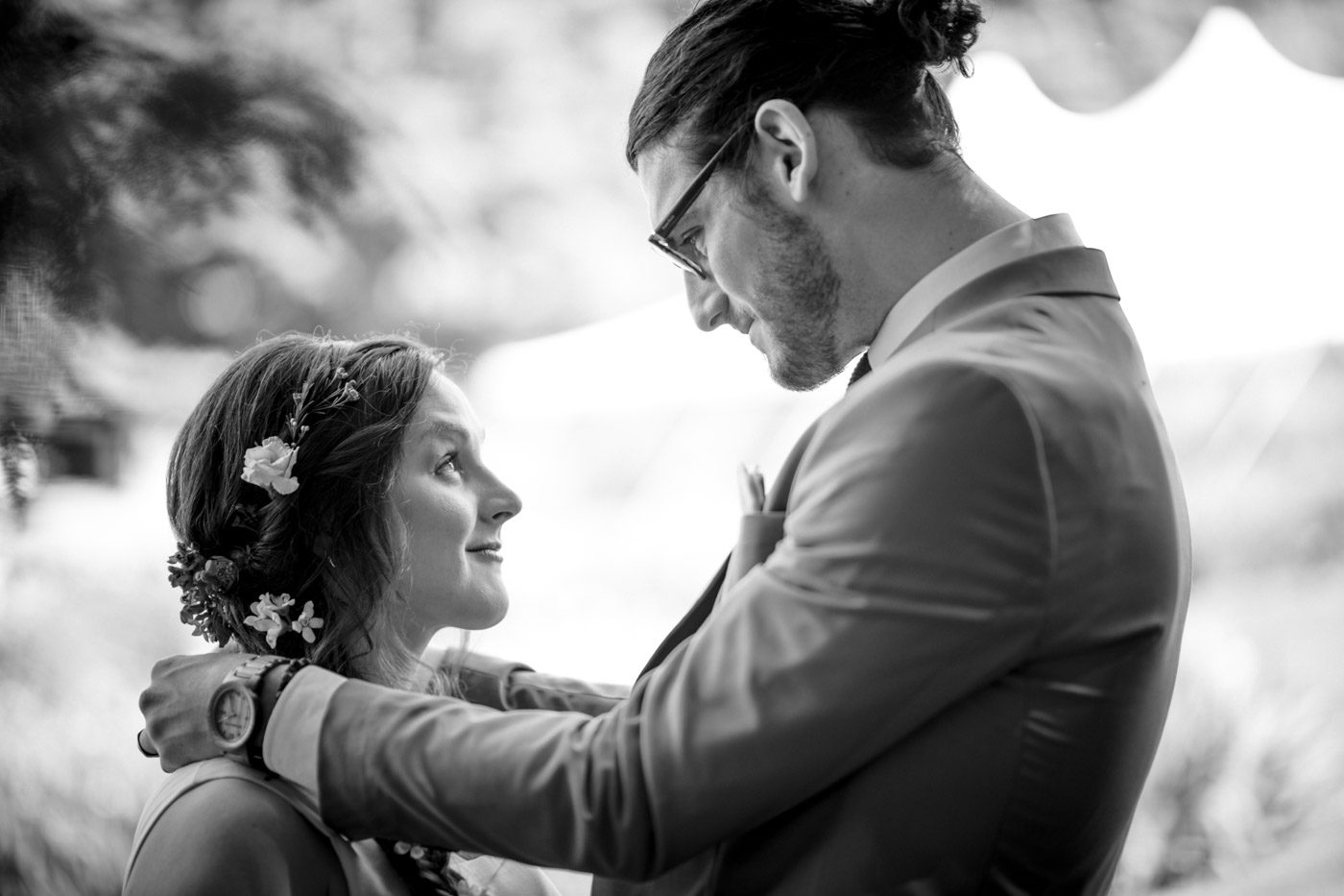 groom-gazing-down-at-bride-in-garden