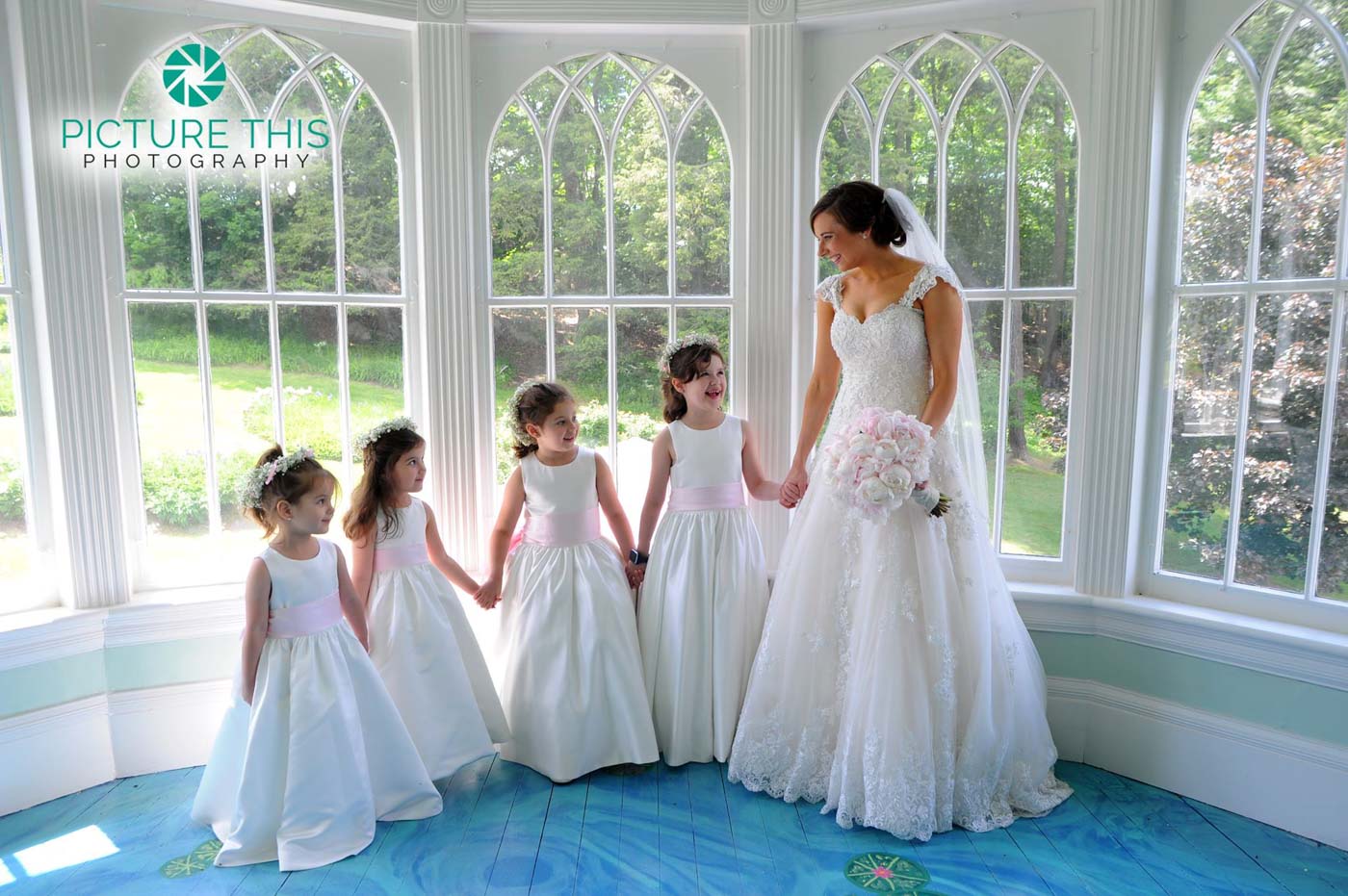 immaculate-bride-with-four-little-girls-on-lilly-pond-porch