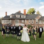 wedding-party-posing-on-back-lawn