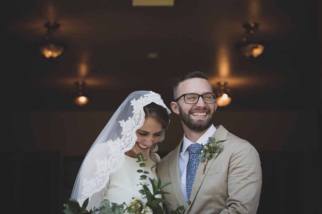 couple standing together at the church