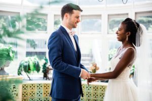 a-july-tent-wedding-couple-on-veranda