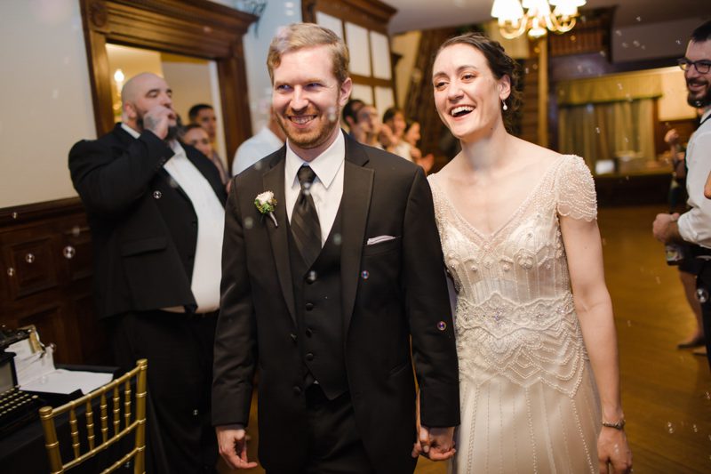 art-deco-wedding-smiling-couple-getting-send-off-by-friends and relatives