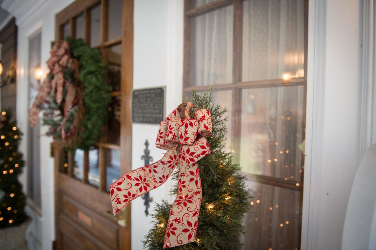 photo of front door with lighted trees